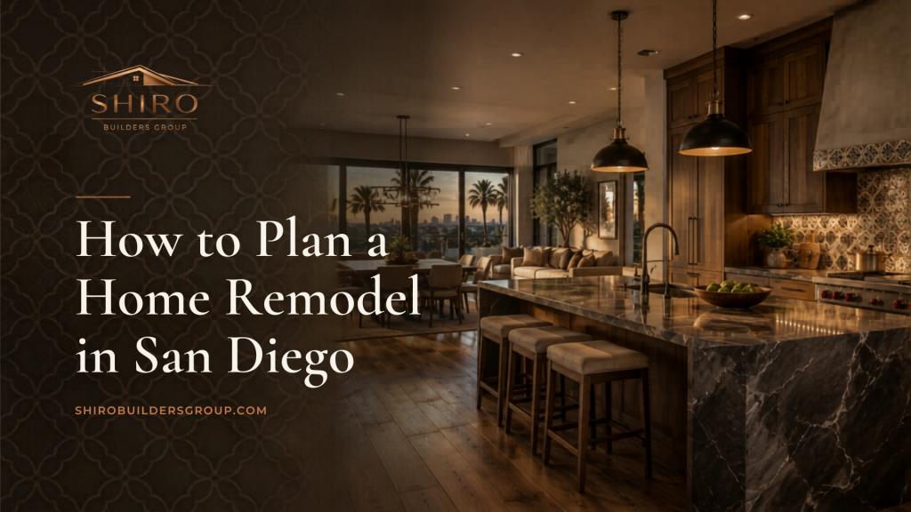Modern open-concept kitchen and living area in San Diego, ideal for home remodeling planning, featuring marble countertops, pendant lighting, and city views through large windows