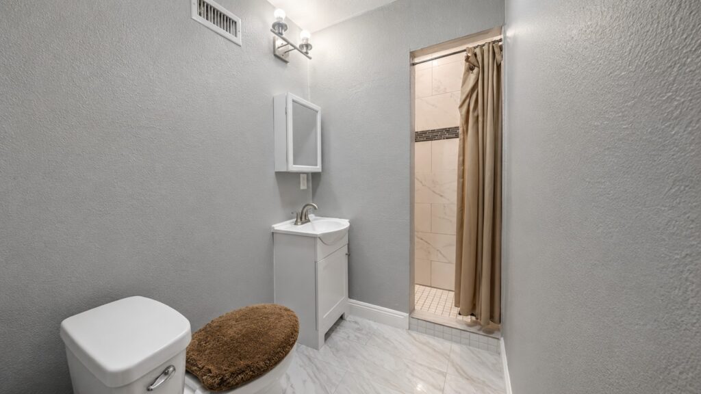 Budget-Friendly Bathroom Refresh: How to Update Flooring, Lighting, and Vanities