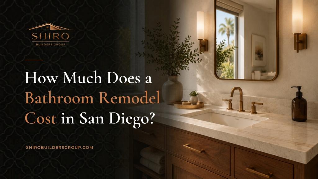 Bathroom remodel cost in San Diego guide featuring a luxury vanity with marble countertop, warm lighting, and brass fixtures