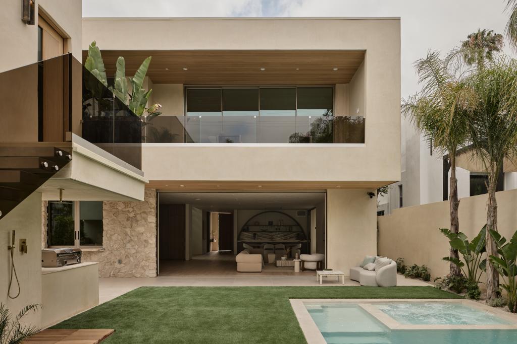 Contemporary backyard design ideas with a swimming pool, artificial grass, outdoor seating, and modern landscaping