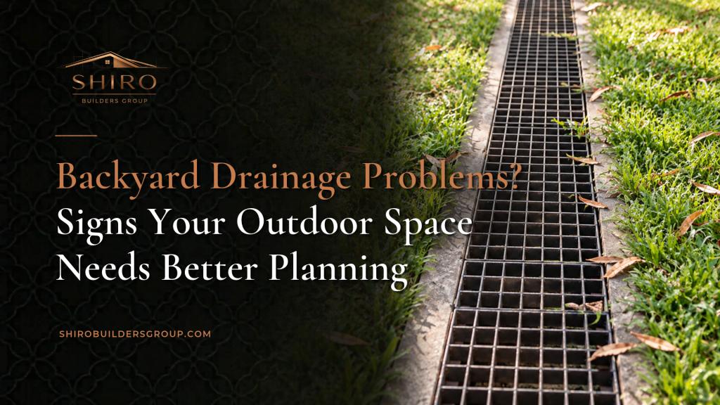 Backyard drainage problems featured image by Shiro Builders Group showing a grated drainage channel surrounded by grass